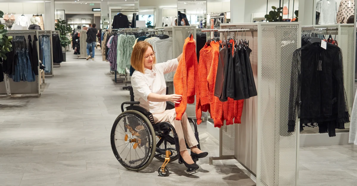 woman in a wheelchair shopping in a retail store