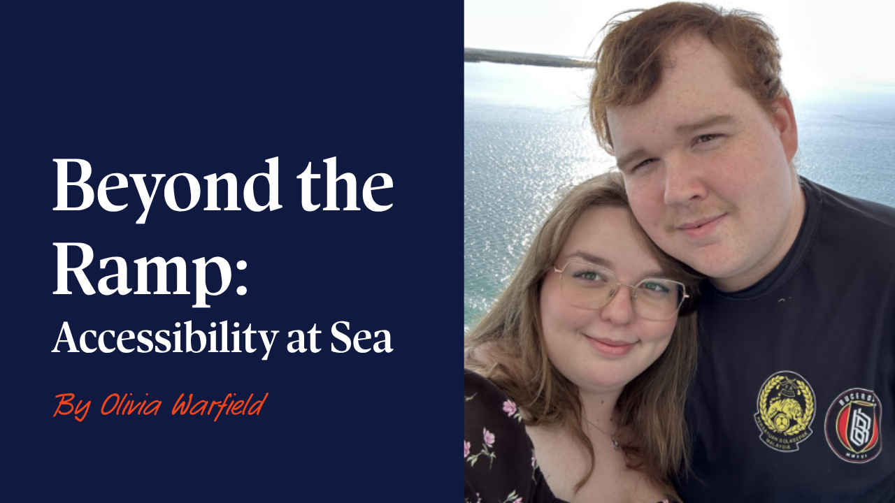 Olivia and her partner are smiling while out at sea on a Cruise ship.
